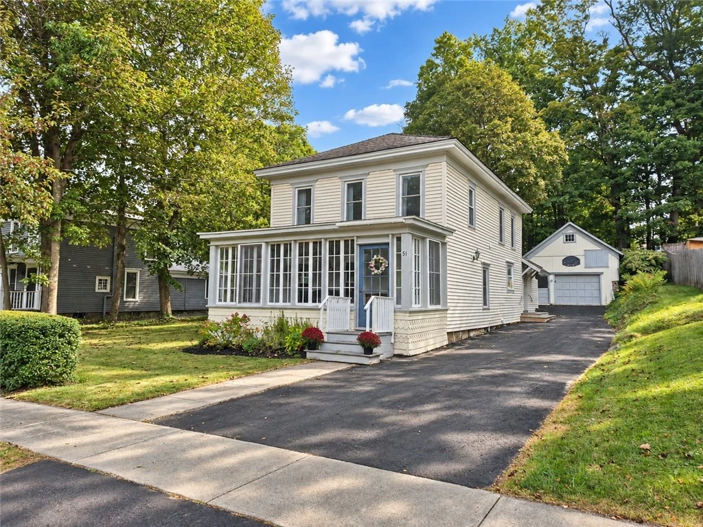 The home and paved driveway from Chapel Street